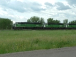 BNSF 9243 and BNSF 9289 in front of a fleet of SD60M's leading a coal drag east